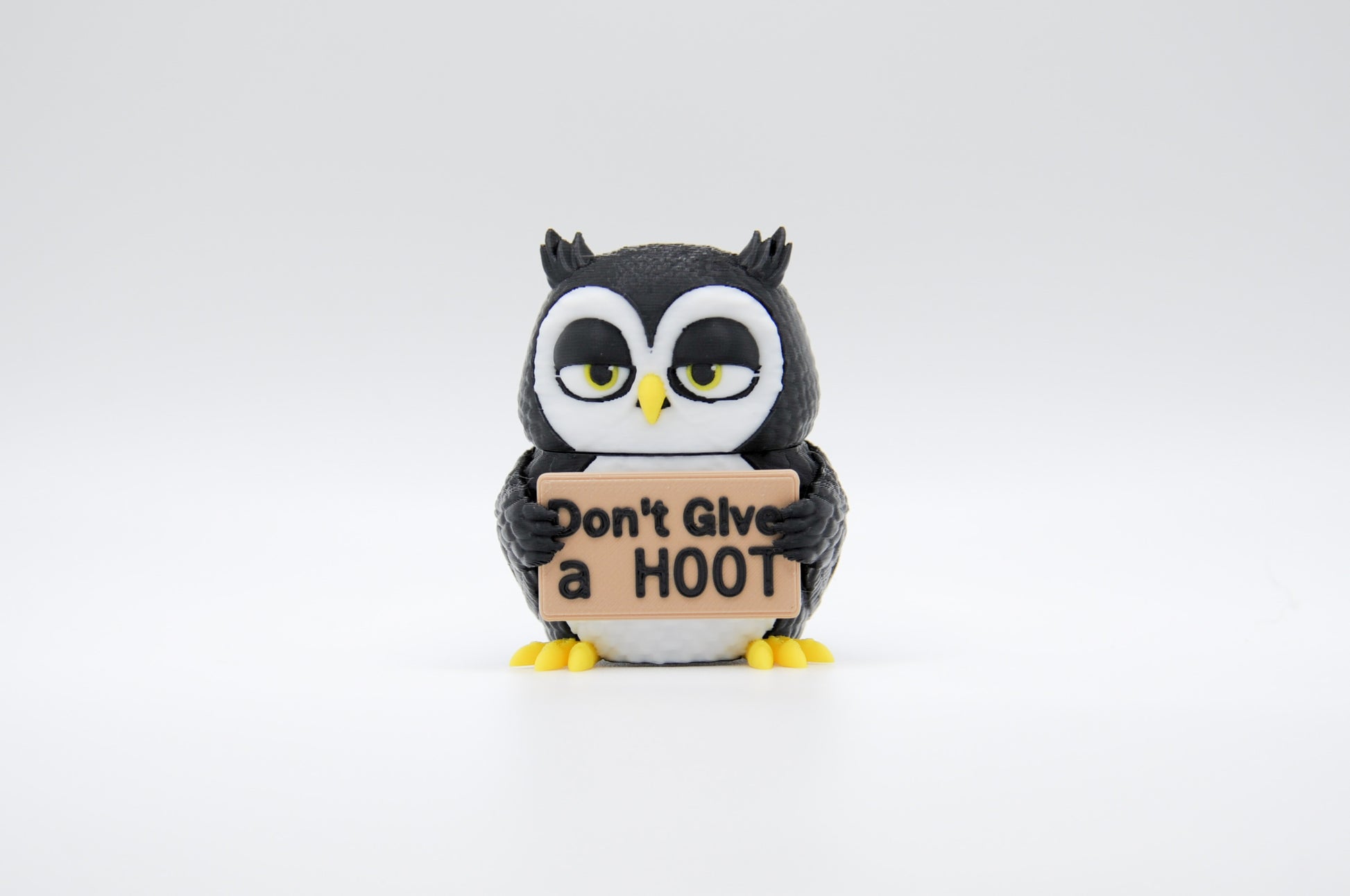 Black owl AWA sign reading Don't Give a Hoot