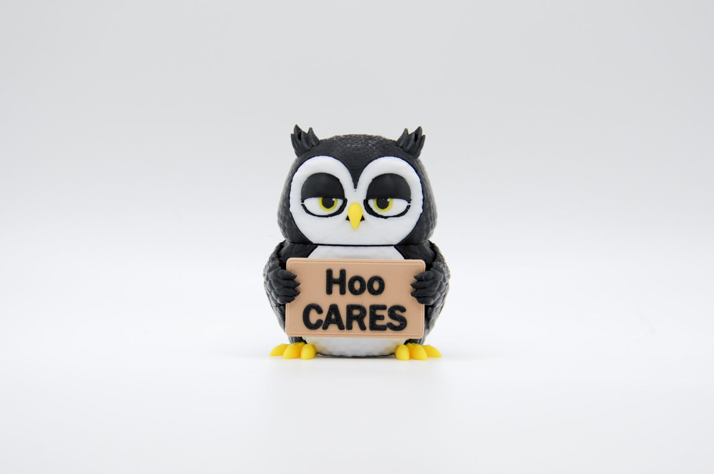 Black owl AWA sign reading Hoo Cares