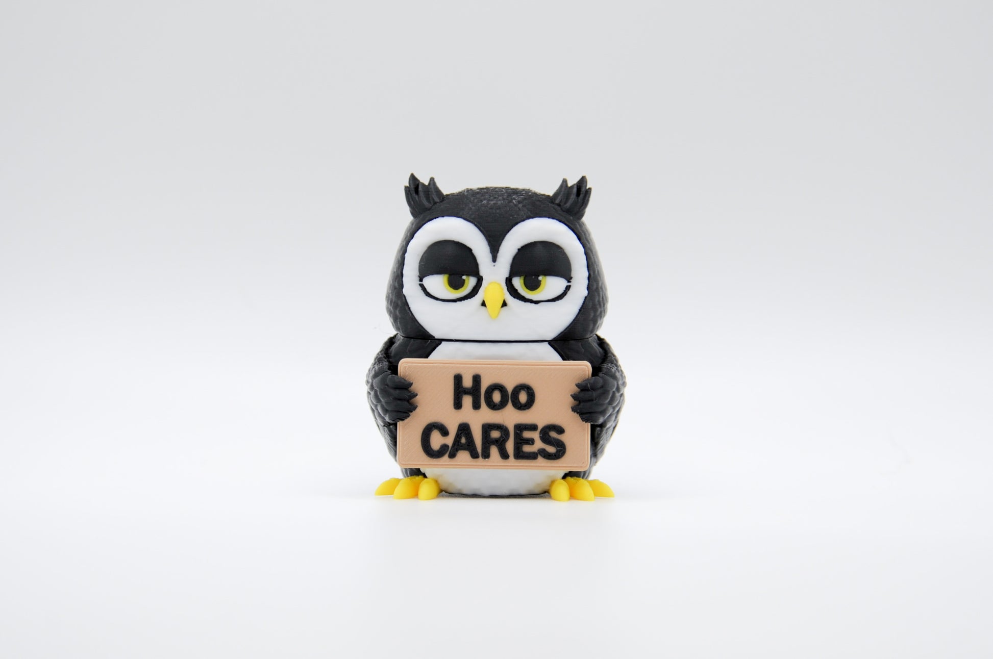 Black owl AWA sign reading Hoo Cares