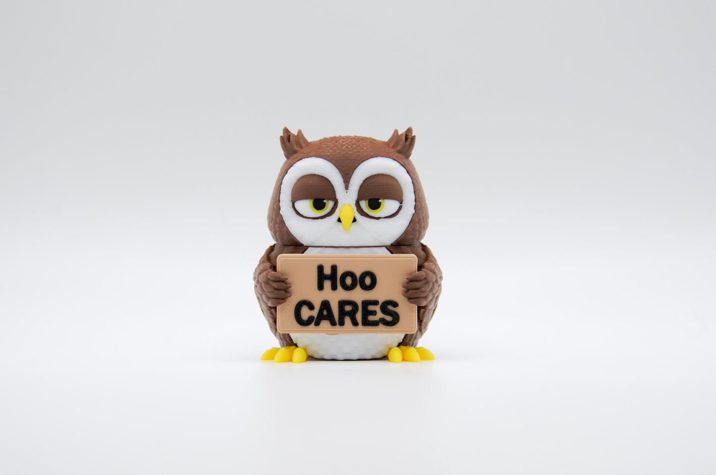 Brown owl AWA sign reading Hoo Cares