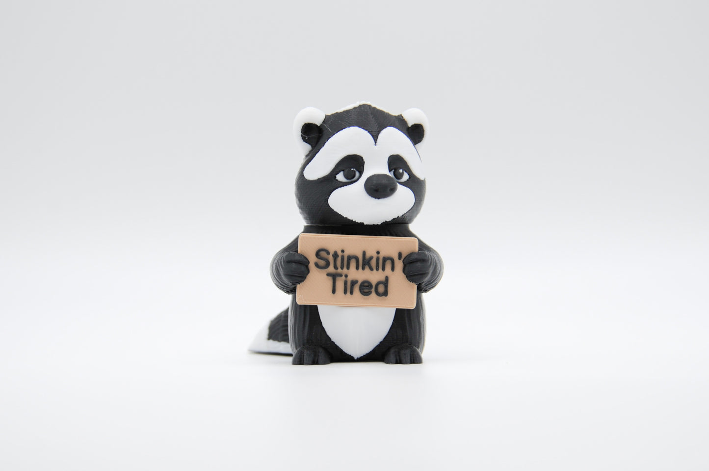 Skunk Animals with Attitude sign reading Stinkin' Tired