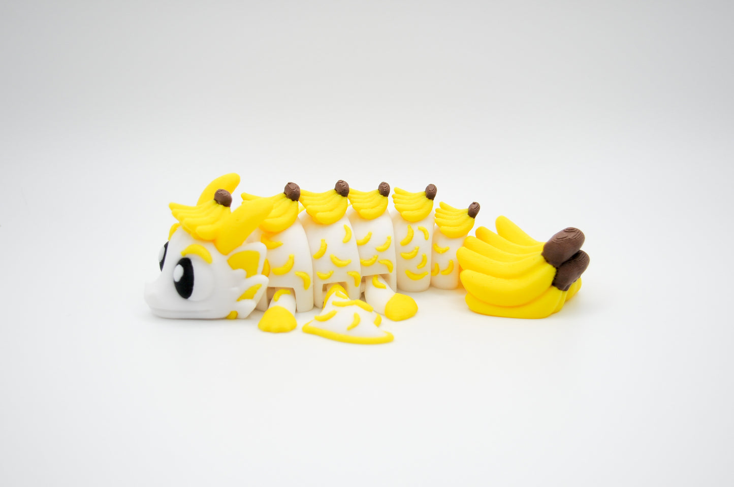 Banana themed articulated dragon 3D printed by InnovaShawn